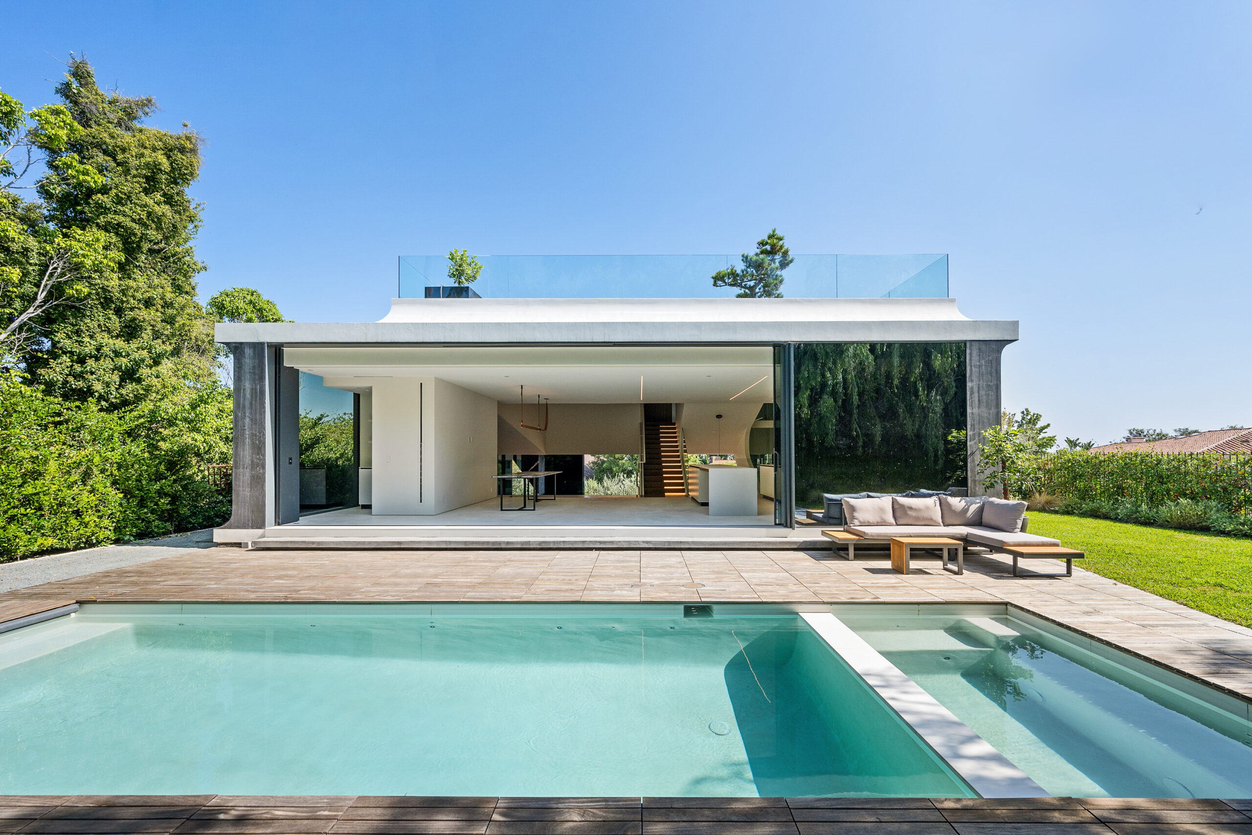 Modern house nestled in lush green surroundings